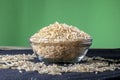 Integral rice on glass bowl isolated on black background