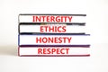 Integrity ethics honesty respect symbol. Concept word Integrity Ethics Honesty Respect on beautiful book. Beautiful white table