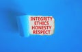 Integrity ethics honesty respect symbol. Concept word Integrity Ethics Honesty Respect on beautiful white paper. Beautiful blue