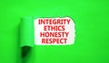 Integrity ethics honesty respect symbol. Concept word Integrity Ethics Honesty Respect on beautiful white paper. Beautiful green