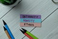 Integrity, Honest, Ethics write on sticky notes isolated on office desk Royalty Free Stock Photo