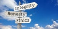 Integrity, honesty, ethics - wooden signpost with three arrows