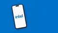 Intel Logo on Mobile Phone Screen on Blue Background with Copy Space Royalty Free Stock Photo