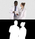 Intellectual healthcare professional afro american doctor with collegue using digital tablet, Alpha Channel Royalty Free Stock Photo