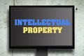 Intellectual property. The inscription on the monitor. Gray concrete background. Concept business Royalty Free Stock Photo