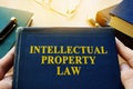 Intellectual property law and other books on a desk. Royalty Free Stock Photo