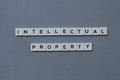 ' Intellectual Property ' word made of square letter word on grey background Royalty Free Stock Photo