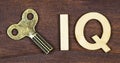 Intelligence quotient, iq test concept, key with letters on a wooden background, banner