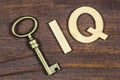 Intelligence quotient, iq test concept, key with letters on a wooden background