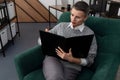 intelligent professional employee woman working on a project while sitting in the office