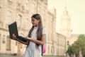 intelligent teen girl work on laptop online in school yard, education and childhood development