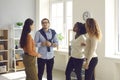 Group of young diverse business people or colleagues talking in informal office meeting Royalty Free Stock Photo