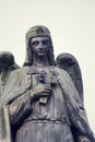 Thinking angel with cross statue, Malostransky cemetery, Prague, Czech Republic