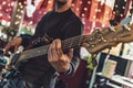 Intense bassist playing during live performance