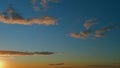 Intense dramatic panoramic sunset. Abstract different shades clouds at sunset sky background. Timelapse. Royalty Free Stock Photo