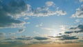 Intense dramatic panoramic sunset. Abstract different shades clouds at sunset sky background. Timelapse. Royalty Free Stock Photo