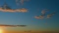 Intense dramatic panoramic sunset. Abstract different shades clouds at sunset sky background. Timelapse. Royalty Free Stock Photo