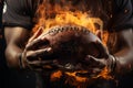 Intense moment American football players hands clutching a fiery ball Royalty Free Stock Photo