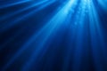 Intense Blue Light Rays Shining Through Dark Gradient Abstract Background Royalty Free Stock Photo