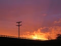 Intense Sunset along Oregon Freeway with Silhouette of Power Lines