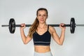 training in gym stressed female athlete is ready to perform an exercise with heavy barbell Royalty Free Stock Photo