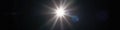 Intense white lens flare, radiating beams on black backdrop , black background, dramatic, energy Royalty Free Stock Photo