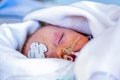 Intensive care, Child infant sedated and wrapped in blankets. Royalty Free Stock Photo
