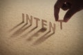 INTENT wood word on compressed board Royalty Free Stock Photo