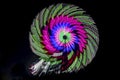 Intentional camera movement, slow shutter Zoom blur image of giant Ferris wheel illuminated and spinning at night Royalty Free Stock Photo