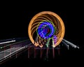 Intentional camera movement, slow shutter Zoom blur image of giant Ferris wheel illuminated and spinning at night in a funfair Royalty Free Stock Photo