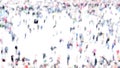 Intentionally blurred abstract aerial image of crowd of unrecognizable people walking in the city.