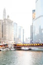 Intentionally blurred Chicago river walk city view in winter with snow, river, bridge and bokeh lights background Royalty Free Stock Photo