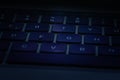 Intentionally dark backlit keys on  laptop keyboard Royalty Free Stock Photo