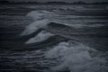 Intentionally dark image of rough seas