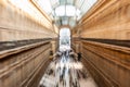 Intentionally motion blurred creative image of people and commuters walking in Galleria Vittorio Emanuele II in Milan, Italy