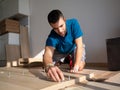 Man Focused on Home Furniture Assembly Royalty Free Stock Photo