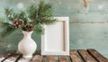 inter still life. Horizontal white frame mockup on vintage wooden bench, table. Modern white ceramic vase with pine tree branches Royalty Free Stock Photo