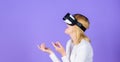 Interact alternative reality. Digital device and modern opportunities. Woman head mounted display violet background