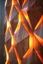 Interactive touchsensitive polygons lighting up in sequence on a wall demonstrating the tactile interface of modern devices