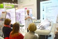 Intercharm XXI International Exhibition Autumn Moscow Team member conducts educational training Royalty Free Stock Photo