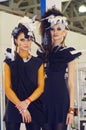 Intercharm XXI International Perfumery and Cosmetics Exhibition Two young beautiful womans in black dress