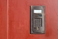 An intercom on metall old door with a keypad. Royalty Free Stock Photo