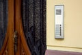 An intercom with a microphone and call buttons. Royalty Free Stock Photo