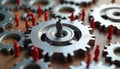 Interconnected gears with red figures corporate world, teamwork. Oversized gear dominates central position. Antitrust concept. Royalty Free Stock Photo