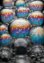 Interconnected soap bubbles display swirling, colorful patterns inside each bubble. Royalty Free Stock Photo