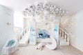 Interer of a spacious blue children`s room. decorative castle game