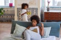 Interested African American woman reading in bed Royalty Free Stock Photo