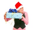Interested business woman shaking present box Royalty Free Stock Photo