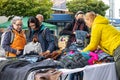 interested buyers checking the offers on a flea market