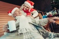 Interested relaxing elderly couple waiting for Xmas Royalty Free Stock Photo